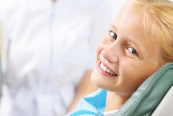 child-in-dentist-chair-smiling-after-sedation